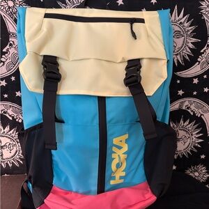 Hoka Blue and Yellow Backpack with Pink Accent